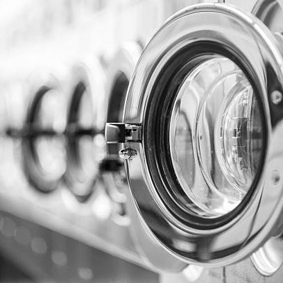 istockphoto-180815119-612x612 A close-up caption from a diagonal view of an opened, metallic lustered clothes washer’s door in a public launderette. The background is out of focus, daylight, no humans. The focus is on the washing machines opened door. Horizontal taken picture with a full frame camera and a prime lens on daylight.